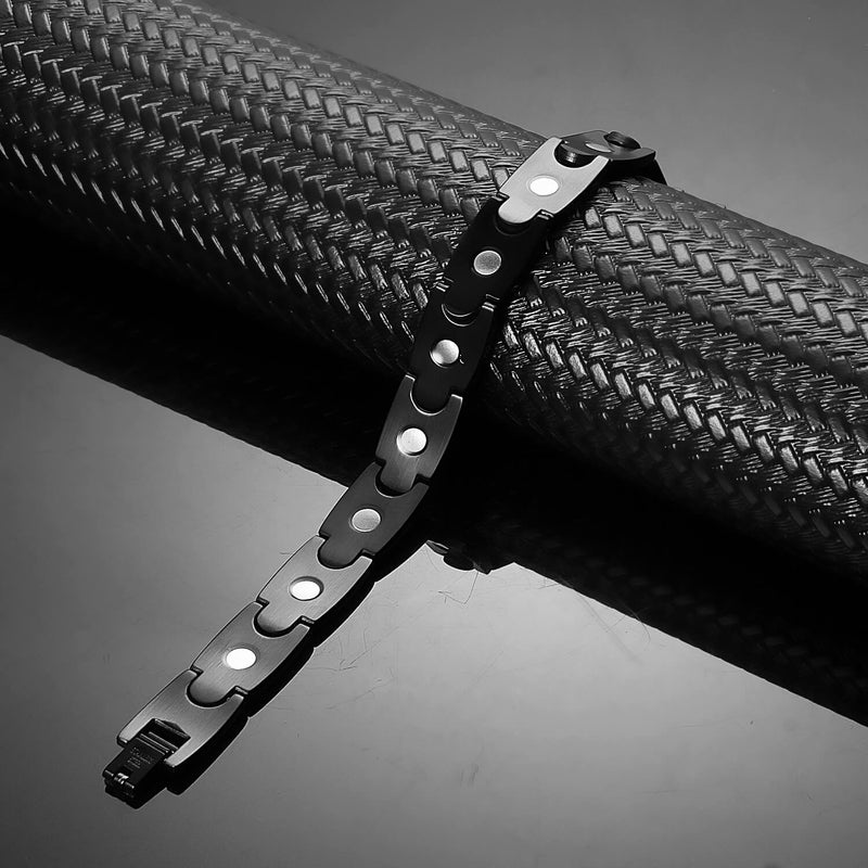 Side view of a stainless steel magnetic bracelet in black color, model B042MB, with magnets and negative ions