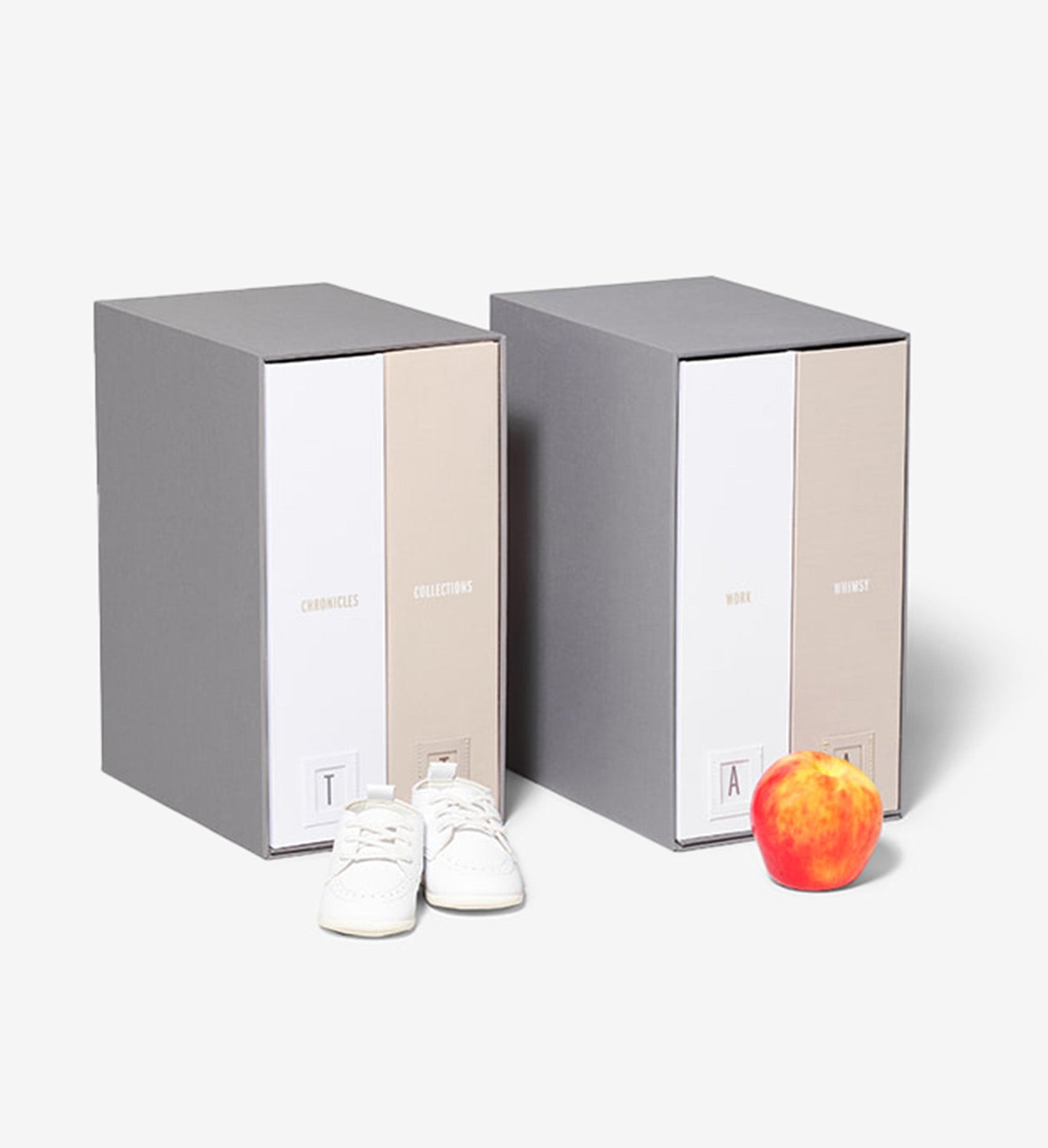 closed slate baby deluxe keepsake box and a closed slate school years deluxe keepsake box with props.