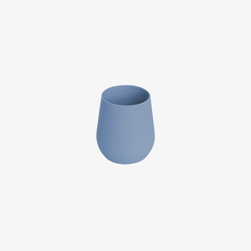 The Tiny Cup in Indigo by ezpz / Open-Top, Silicone Drinking Cup for Babies #color_indigo