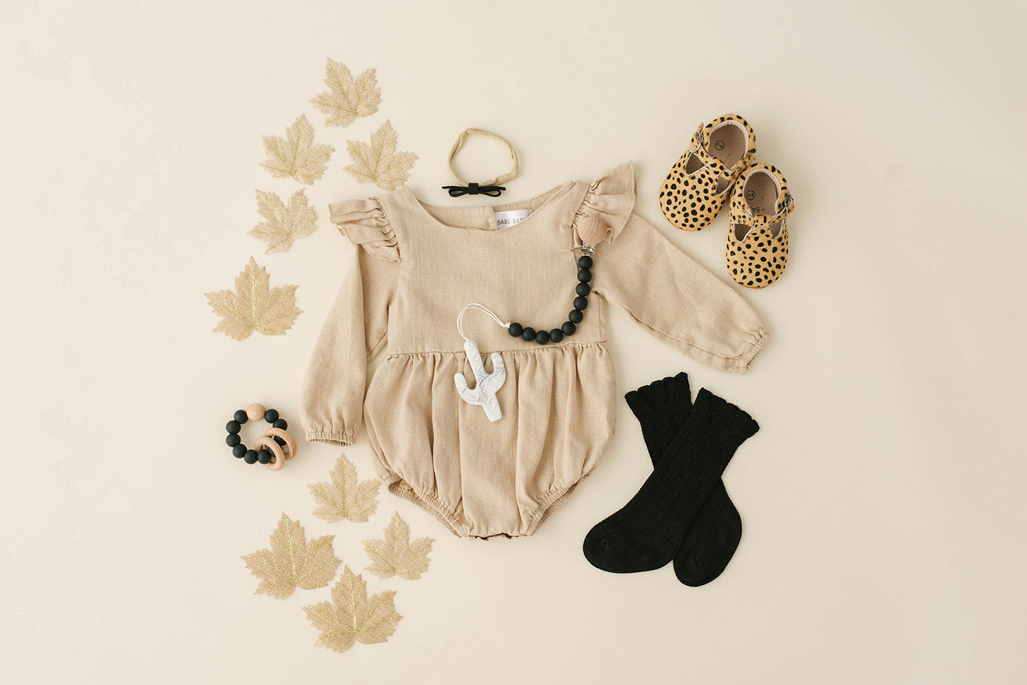 Oatmeal Linen Flutter Sleeve Baby Romper – Soft & Stylish by Babe Basics