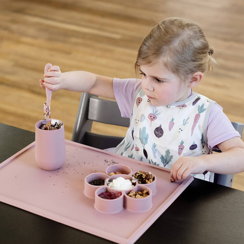 The Play Mat in Blush by ezpz / Large Silicone Craft Plate that Suctions to the Table #color_blush / Play Mat – Non-Tip Craft + Activity Surface for Toddlers by ezpz