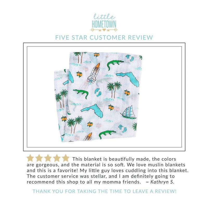 Floral-themed baby muslin swaddle blanket and burp cloth set, featuring vibrant pink and green flowers.