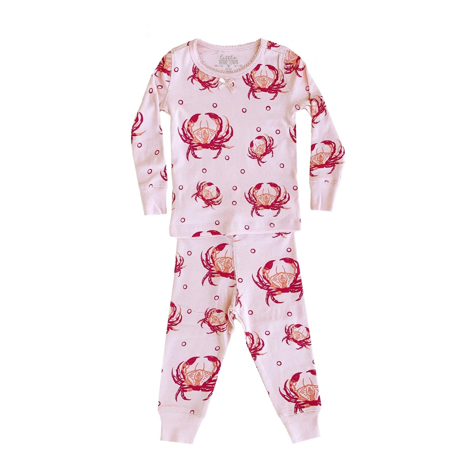Pink children's pajamas with playful crab illustrations, featuring a cozy long-sleeve top and matching pants.