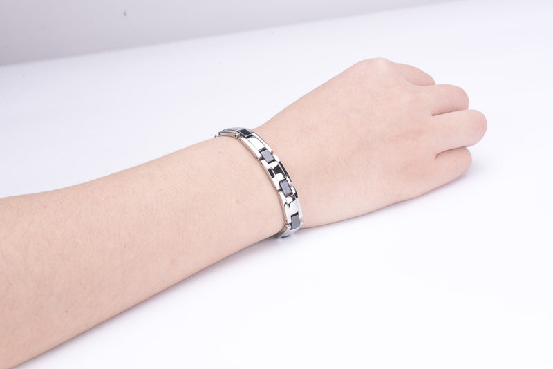 Ladies' silver and black stainless steel energy bracelet with magnets