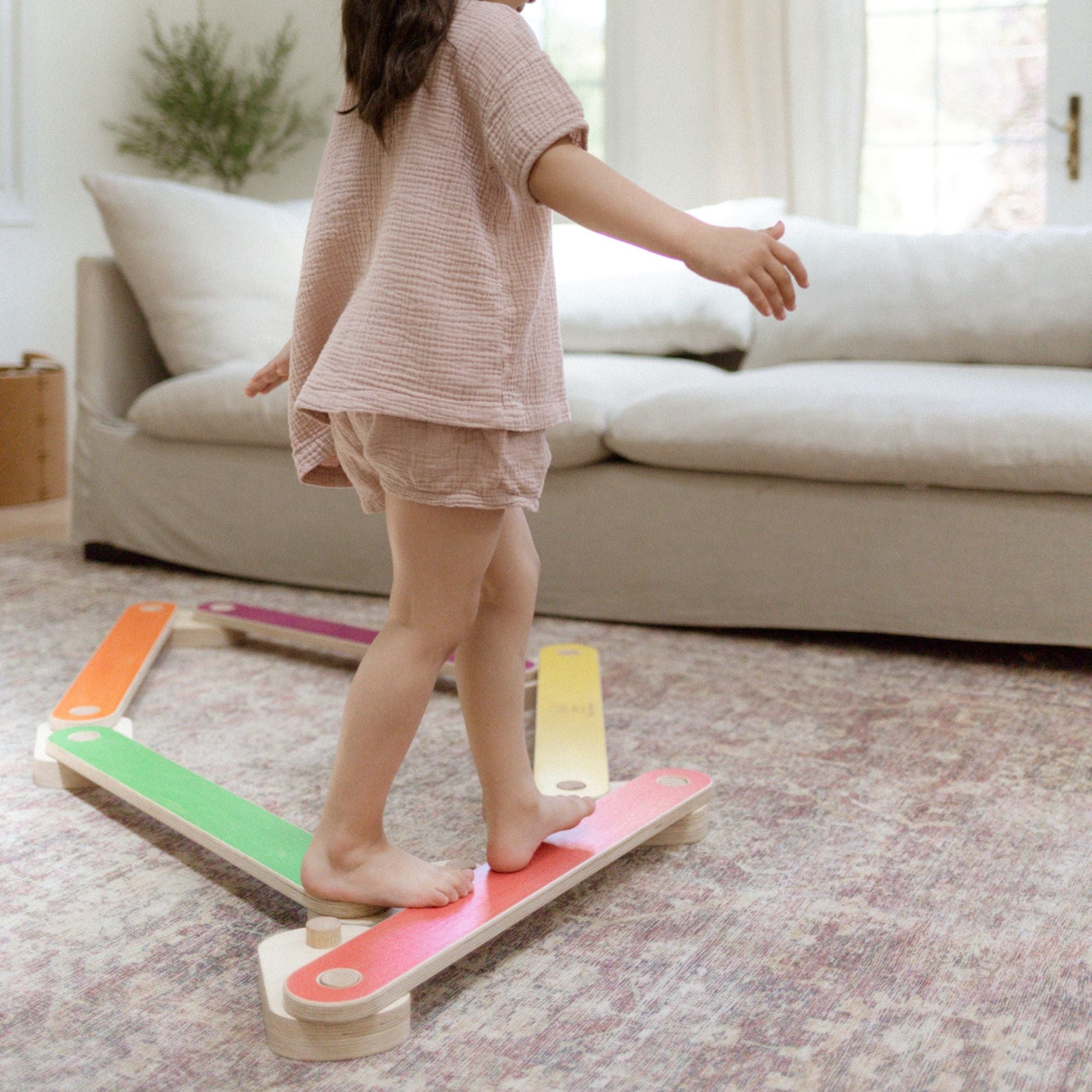 Kid walking on a balance beam