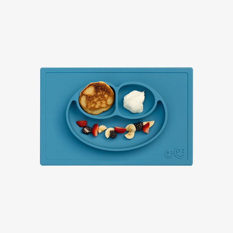 Happy Mat in Blue by ezpz / The Original All-In-One Silicone Plates & Placemats that Stick to the Table #color_blue