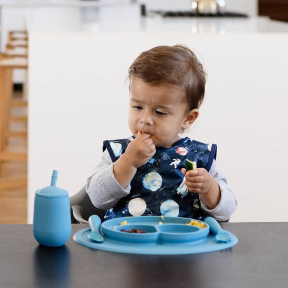 The Mini Cup + Straw in Blue by ezpz / Silicone Drinking Cup and Straw Training System for Toddlers #color_blue