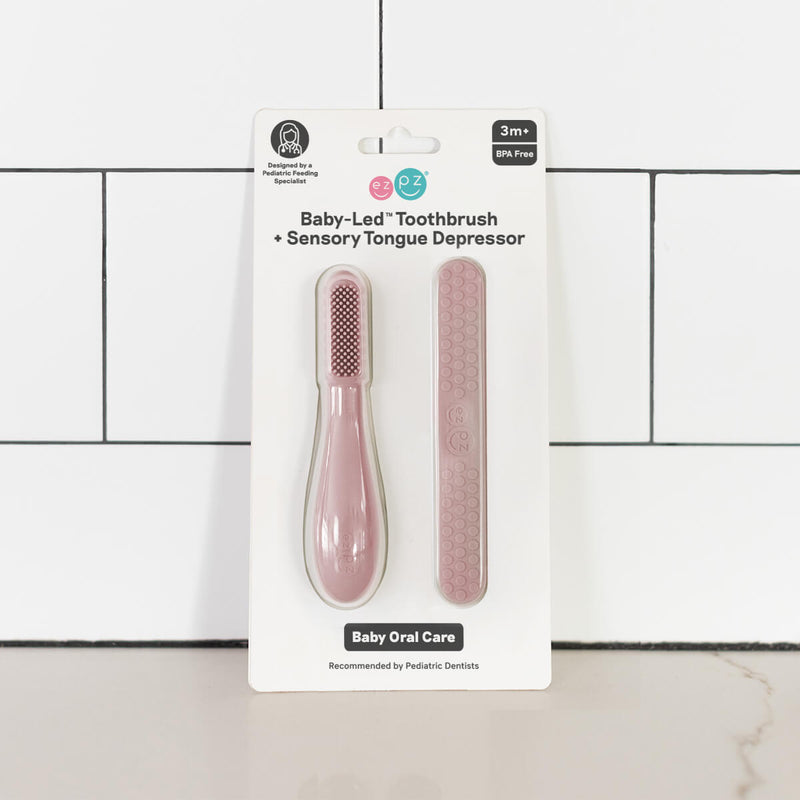 ezpz baby led toothbrush and sensory tongue depressor in blush pink #color_blush