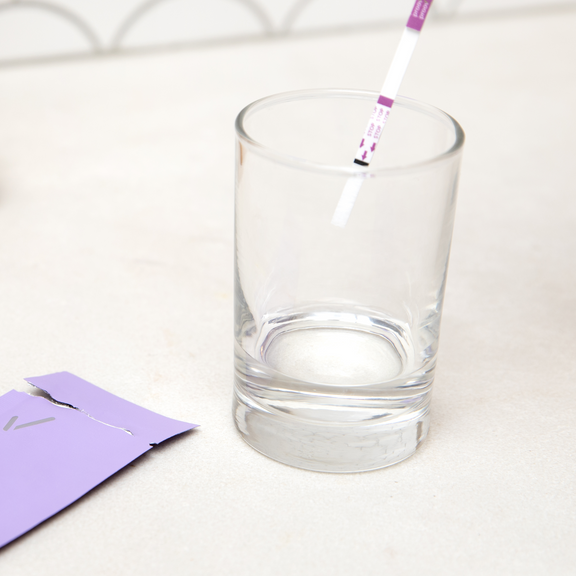 dipping confirm test strip into sample