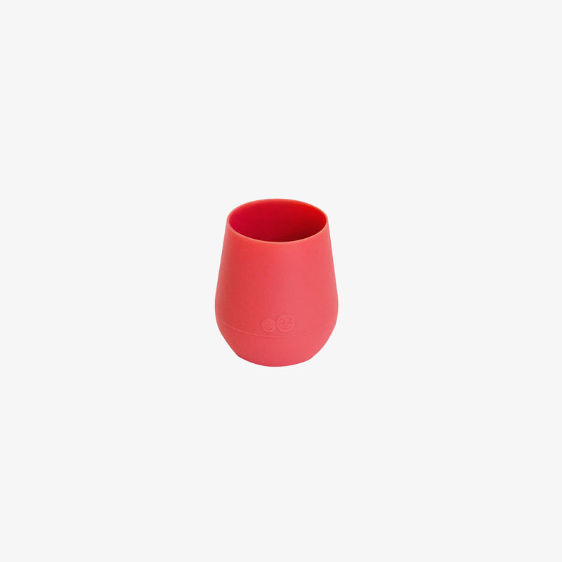 The Tiny Cup in Coral by ezpz / Open-Top, Silicone Drinking Cup for Babies #color_coral
