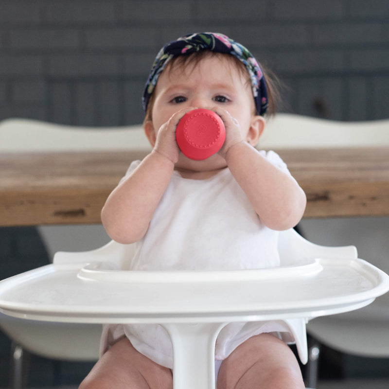 The Tiny Cup in Coral by ezpz / Open-Top, Silicone Drinking Cup for Babies #color_coral