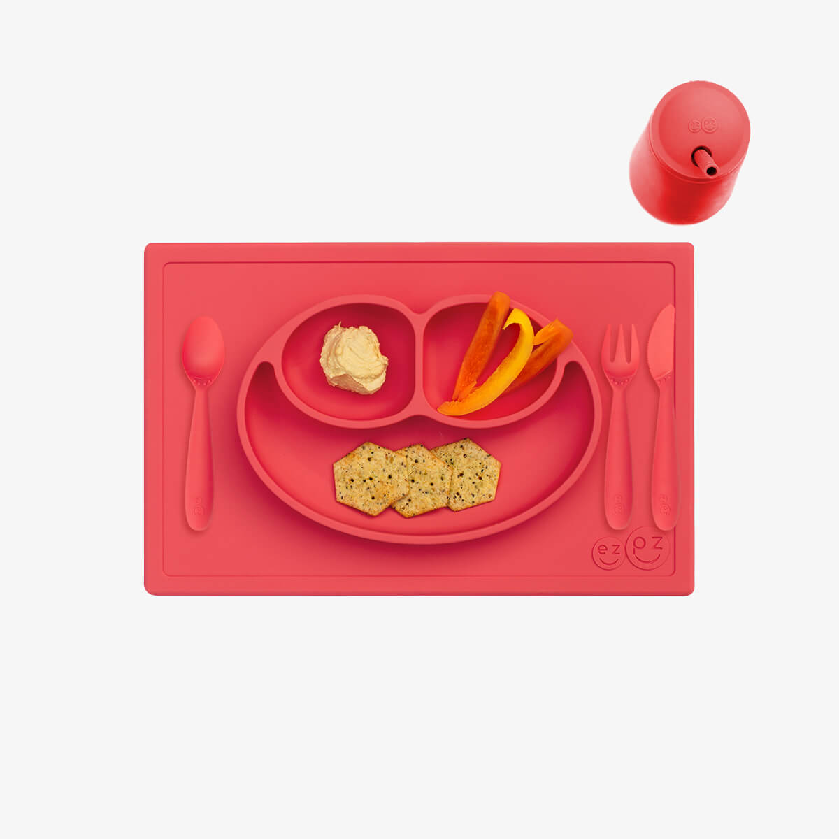 ezpz Happy Feeding Set in Coral / Silicone, Self-Suctioning Plate, Silicone Cup and Straw, Training Utensils for Toddlers #color_coral