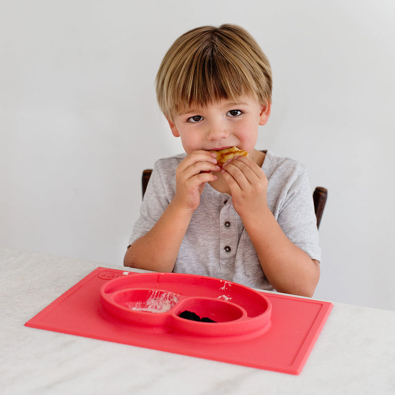 Happy Mat in Coral by ezpz / The Original All-In-One Silicone Plates & Placemats that Stick to the Table #color_coral