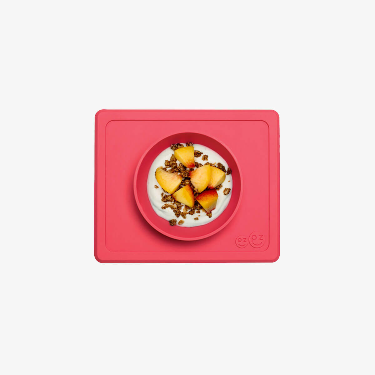 Mini Bowl in Coral by ezpz / The Original All-In-One Silicone Plates & Placemats that Stick to the Table #color_coral