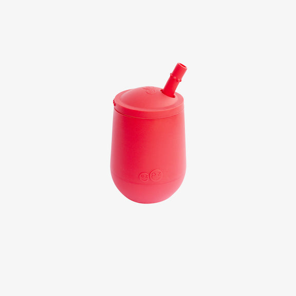 The Mini Cup + Straw in Coral by ezpz / Silicone Drinking Cup and Straw Training System for Toddlers #color_coral