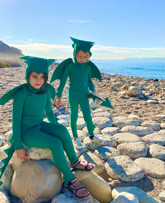 Green Dinosaur or Dragon Costume for Kids. Made with the most eco-friendly upcycled cotton for environmental sustainability. A pajama costume, hat, wings, tail, and cozy pajamas. Open ended toy for kids and toddlers, pretend play, Green Dragon Costume – Baby / Kids’ Dress Up & Pretend Play Band of the Wild