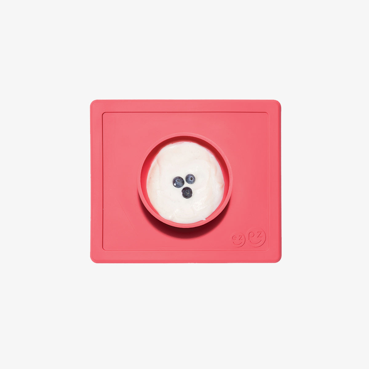 Happy Bowl in Coral by ezpz / The Original All-In-One Silicone Plates & Placemats that Stick to the Table #color_coral / Happy Bowl – Self-Feeding Made Simple for Babies & Toddlers by ezpz