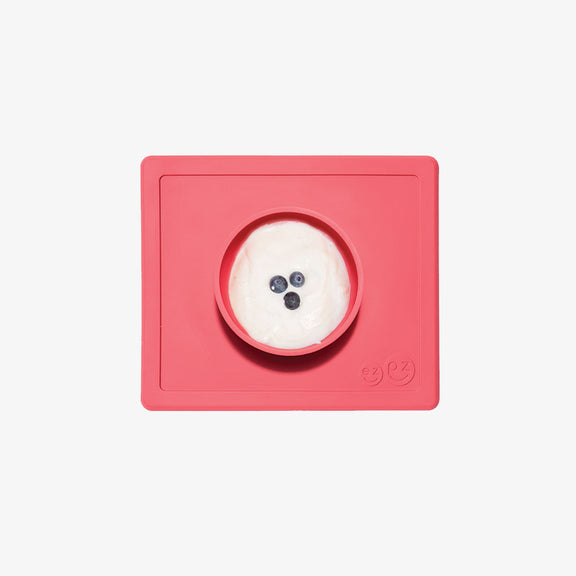 Happy Bowl in Coral by ezpz / The Original All-In-One Silicone Plates & Placemats that Stick to the Table #color_coral / Happy Bowl – Self-Feeding Made Simple for Babies & Toddlers by ezpz