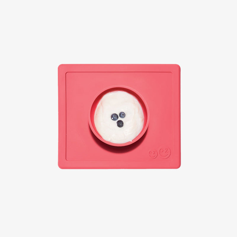 Happy Bowl in Coral by ezpz / The Original All-In-One Silicone Plates & Placemats that Stick to the Table #color_coral / Happy Bowl – Self-Feeding Made Simple for Babies & Toddlers by ezpz