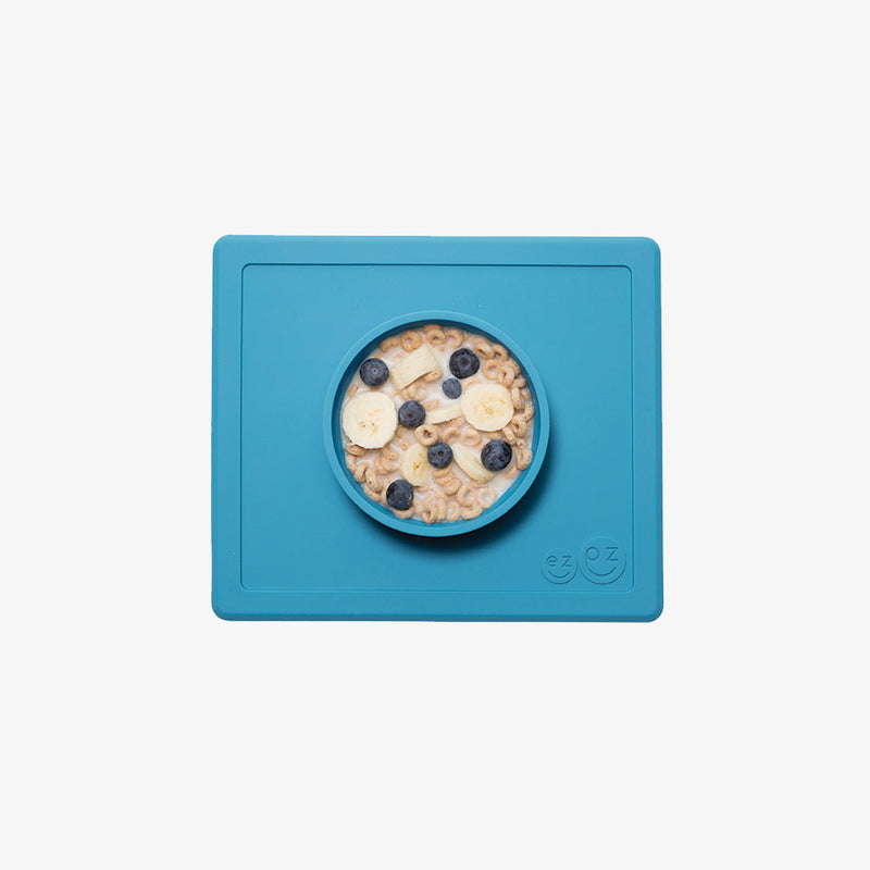 Happy Bowl in Blue by ezpz / The Original All-In-One Silicone Plates & Placemats that Stick to the Table #color_blue / Happy Bowl – Self-Feeding Made Simple for Babies & Toddlers by ezpz