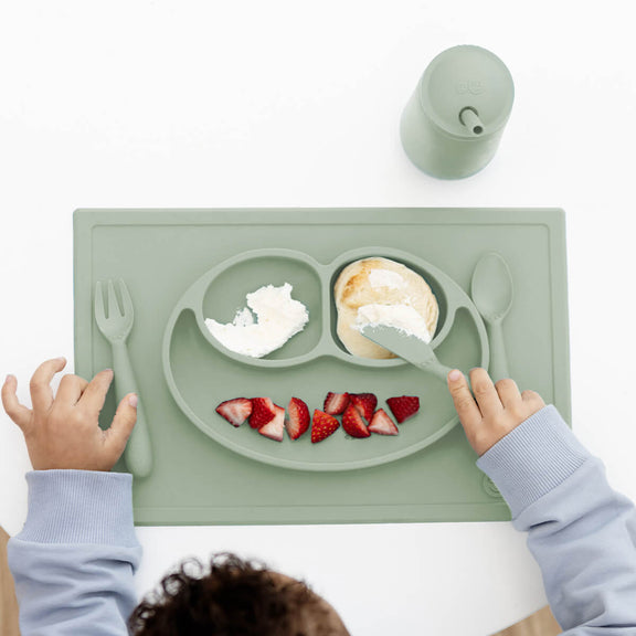ezpz Happy Feeding Set in Sage / Silicone, Self-Suctioning Plate, Silicone Cup and Straw, Training Utensils for Toddlers #color_sage