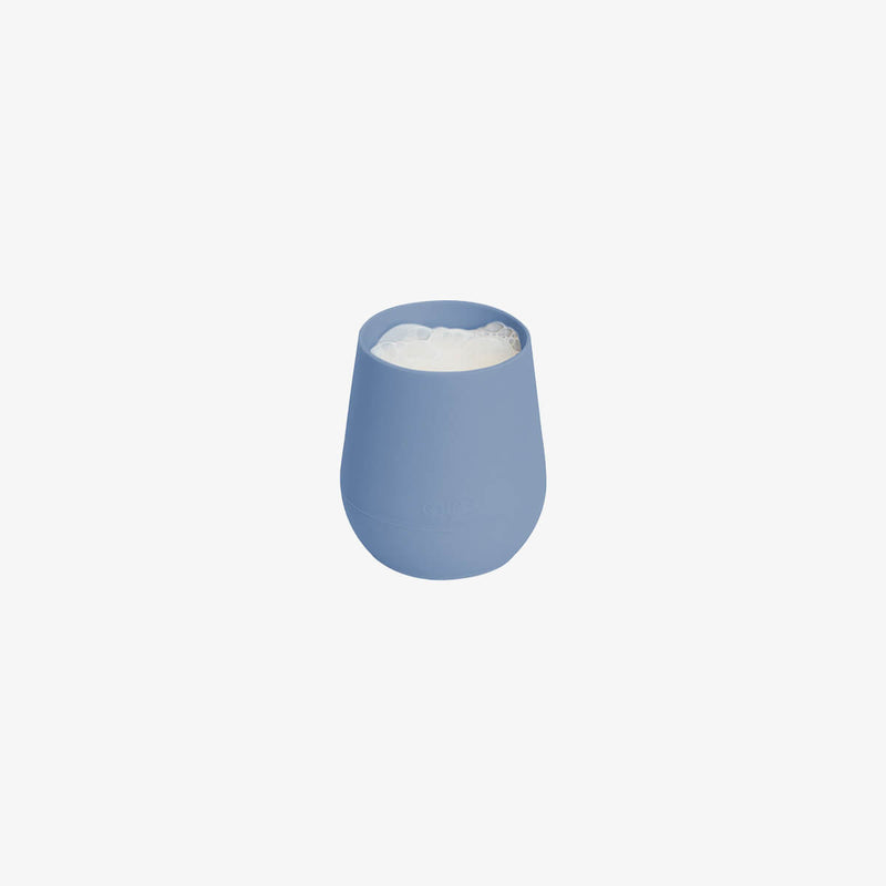 The Tiny Cup in Indigo by ezpz / Open-Top, Silicone Drinking Cup for Babies #color_indigo