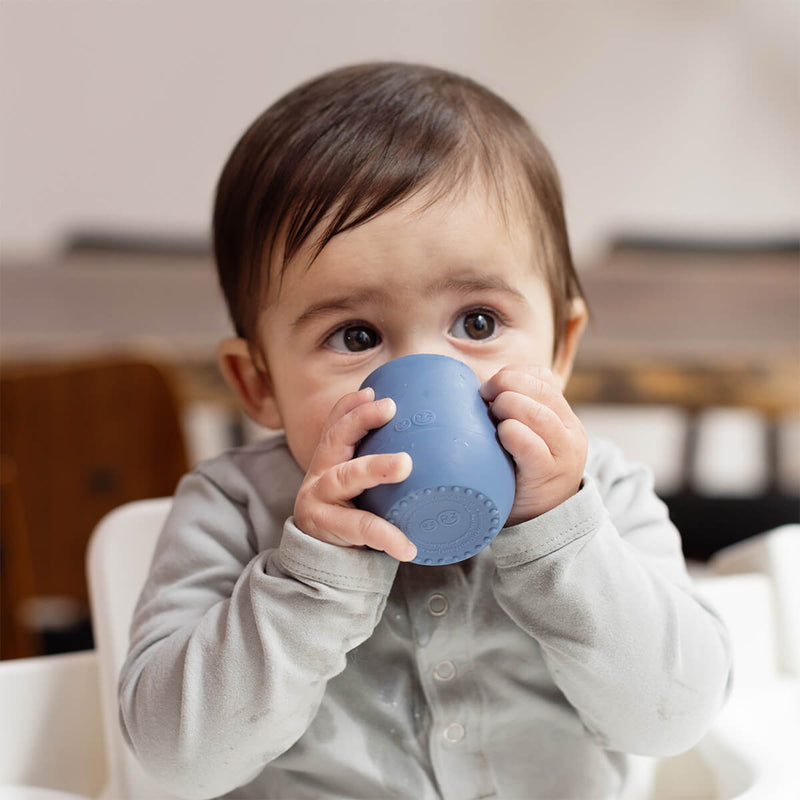 The Tiny Cup in Indigo by ezpz / Open-Top, Silicone Drinking Cup for Babies #color_indigo