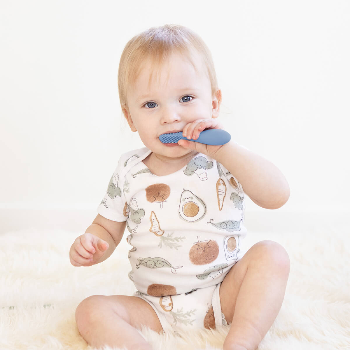 ezpz baby led toothbrush and sensory tongue depressor in indigo blue #color_indigo
