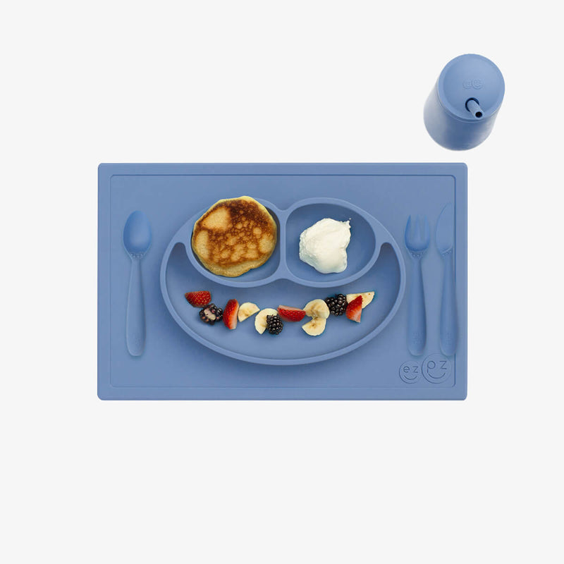ezpz Happy Feeding Set in Indigo / Silicone, Self-Suctioning Plate, Silicone Cup and Straw, Training Utensils for Toddlers #color_indigo