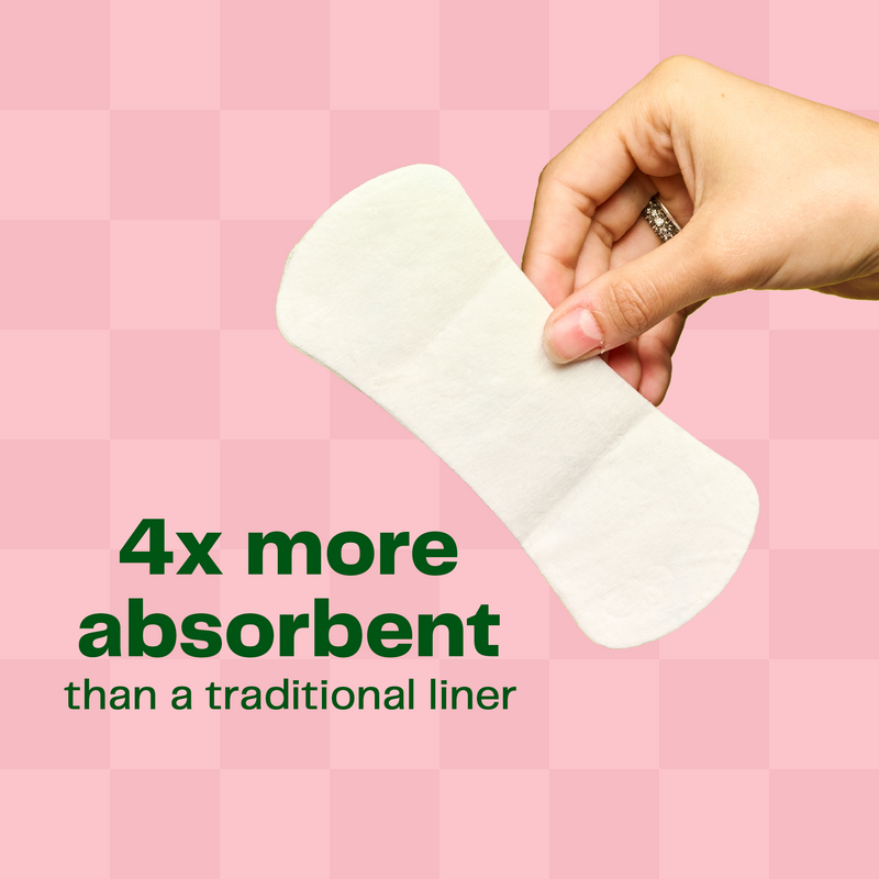 Hand holding a panty liner with text that says that it is 4 times more absorbent than a traditional liner.