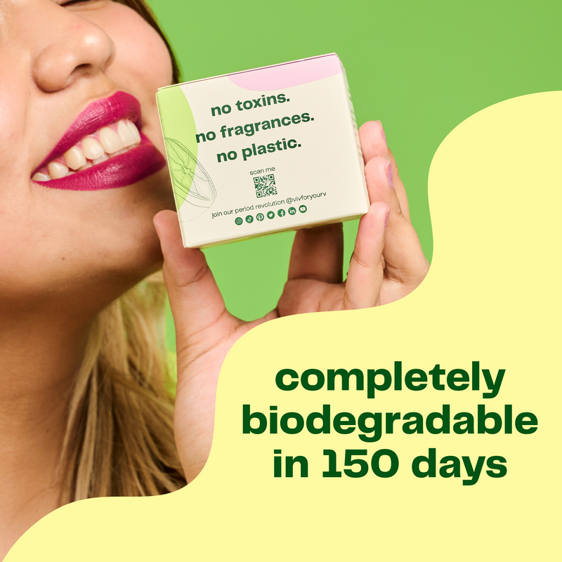 A girl holding a box of Viv bamboo liners with a text saying it has no toxins no fragrances no plastic and is completely biodegradable in 150 days.