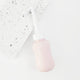 peri bottle for postpartum recovery laying on a terrazzo tile