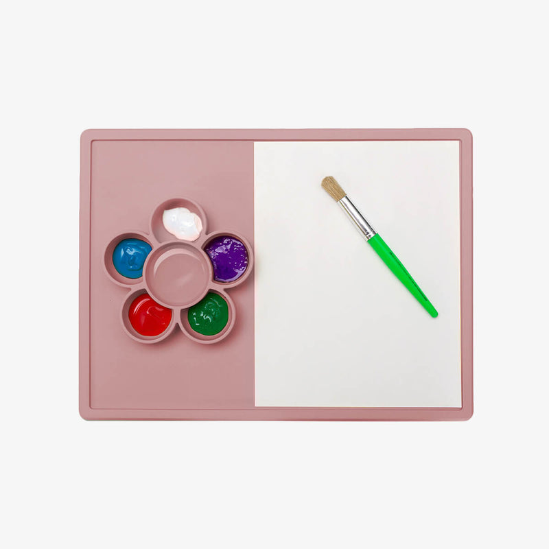 The Play Mat in Blush by ezpz / Large Silicone Craft Plate that Suctions to the Table #color_blush / Play Mat – Non-Tip Craft + Activity Surface for Toddlers by ezpz