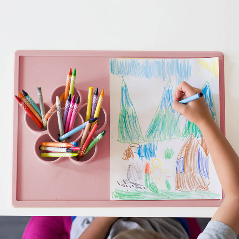The Play Mat in Blush by ezpz / Large Silicone Craft Plate that Suctions to the Table #color_blush / Play Mat – Non-Tip Craft + Activity Surface for Toddlers by ezpz
