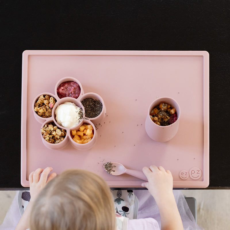 The Play Mat in Blush by ezpz / Large Silicone Craft Plate that Suctions to the Table #color_blush / Play Mat – Non-Tip Craft + Activity Surface for Toddlers by ezpz