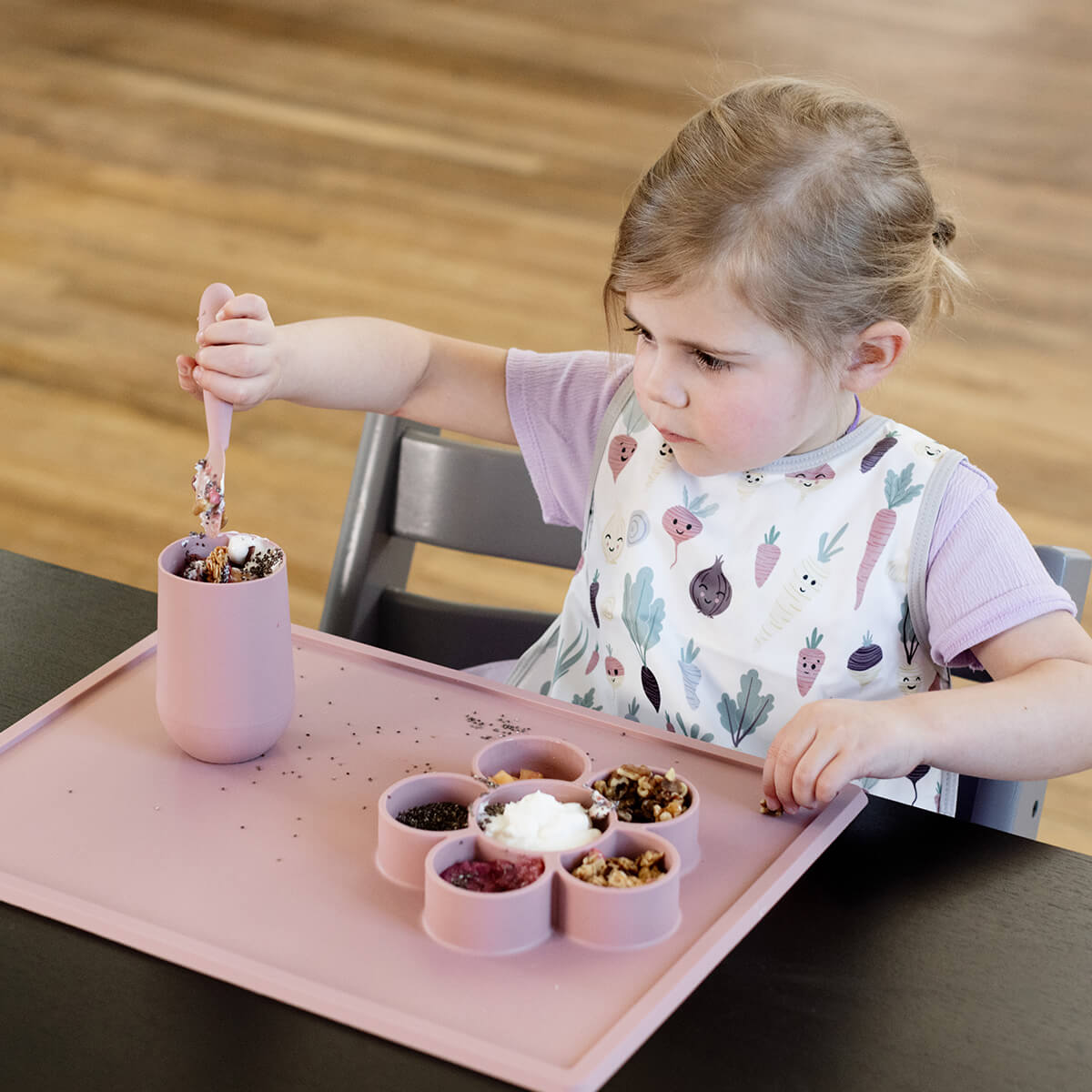 The Play Mat in Blush by ezpz / Large Silicone Craft Plate that Suctions to the Table #color_blush / Play Mat – Non-Tip Craft + Activity Surface for Toddlers by ezpz