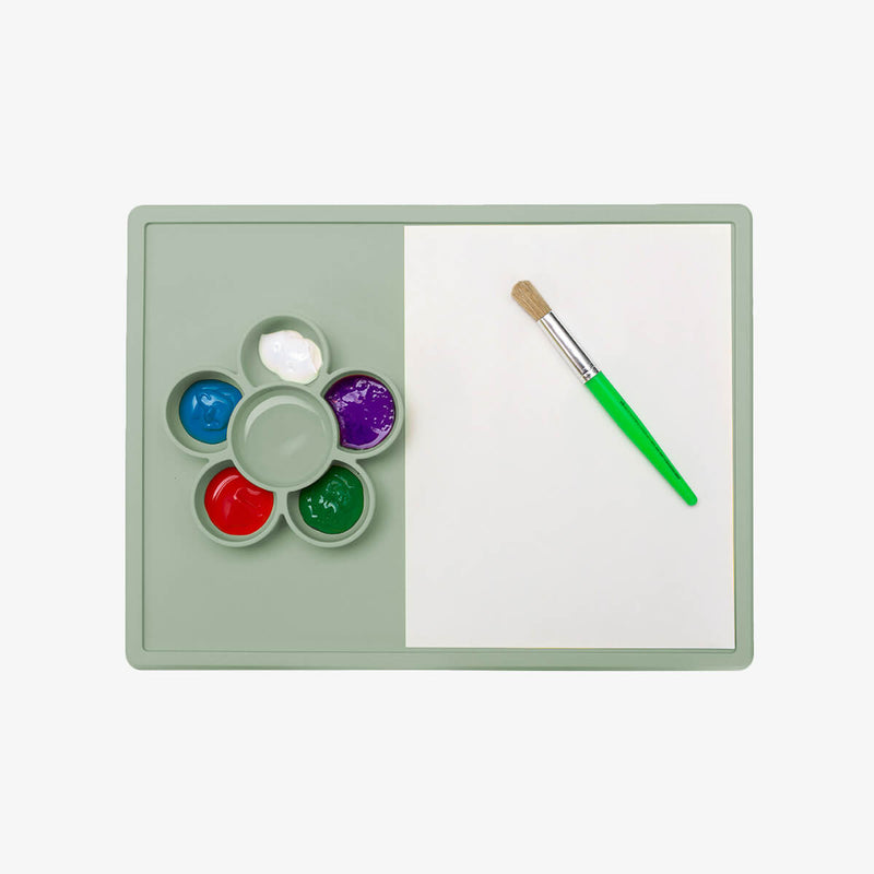 The Play Mat in Sage by ezpz / Large Silicone Craft Plate that Suctions to the Table #color_sage / Play Mat – Non-Tip Craft + Activity Surface for Toddlers by ezpz