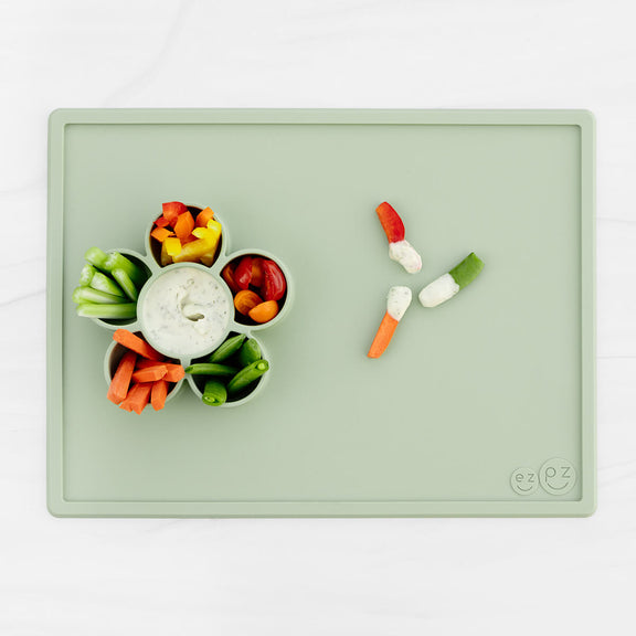 The Play Mat in Sage by ezpz / Large Silicone Craft Plate that Suctions to the Table #color_sage / Play Mat – Non-Tip Craft + Activity Surface for Toddlers by ezpz