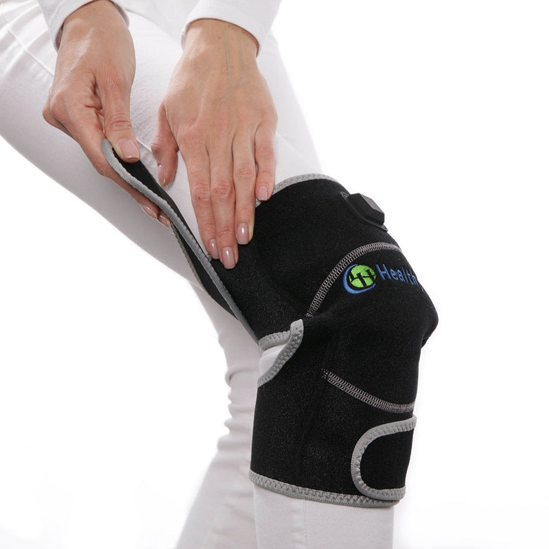 Portable knee heated gemstone pad provides deep penetrating heat
