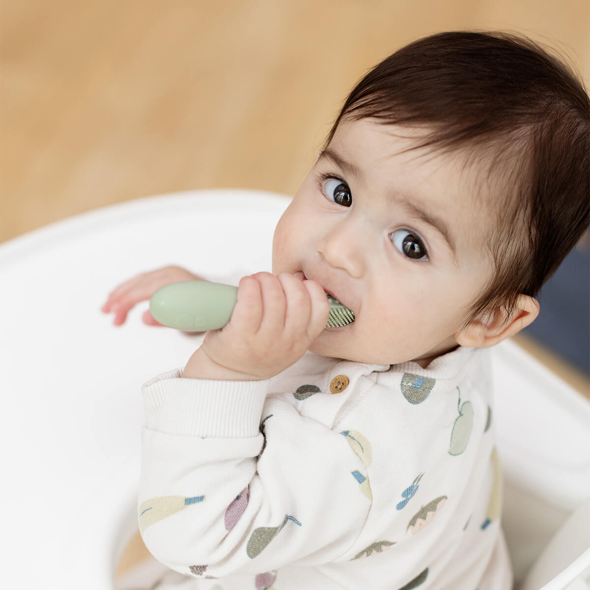 ezpz baby led toothbrush and sensory tongue depressor in sage green #color_sage