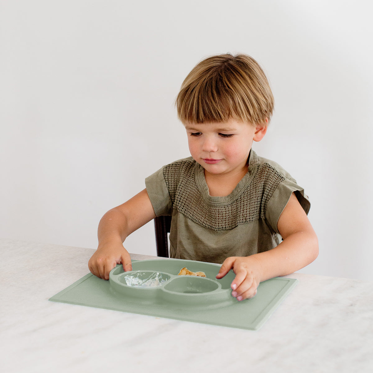 Happy Mat in Sage by ezpz / The Original All-In-One Silicone Plates & Placemats that Stick to the Table #color_sage