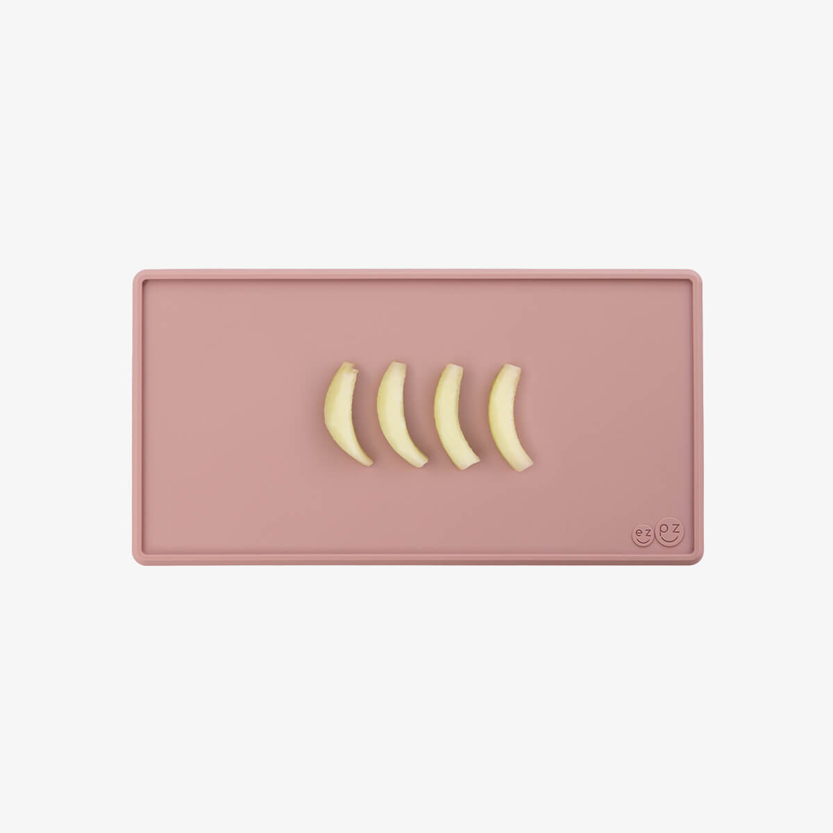 The Tiny Placemat in Blush is a non-slip, silicone placemat that fits on most highchair trays #color_blush / Tiny Placemat – On-the-Go Mealtime Mat for Babies & Toddlers