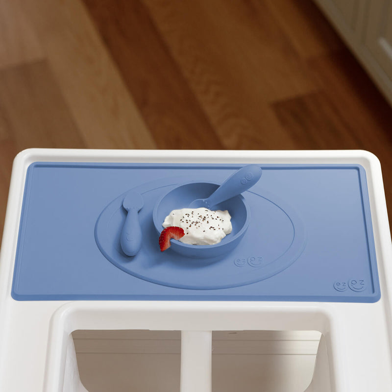 The Tiny Placemat in Indigo is a non-slip, silicone placemat that fits on most highchair trays #color_indigo / Tiny Placemat – On-the-Go Mealtime Mat for Babies & Toddlers