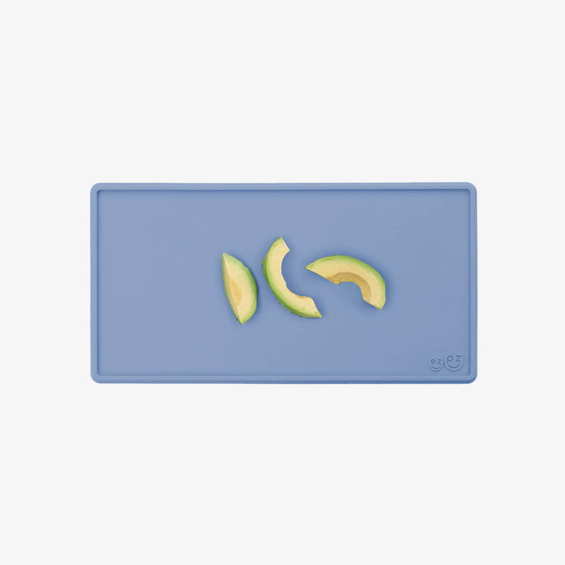 The Tiny Placemat in Indigo is a non-slip, silicone placemat that fits on most highchair trays #color_indigo / Tiny Placemat – On-the-Go Mealtime Mat for Babies & Toddlers