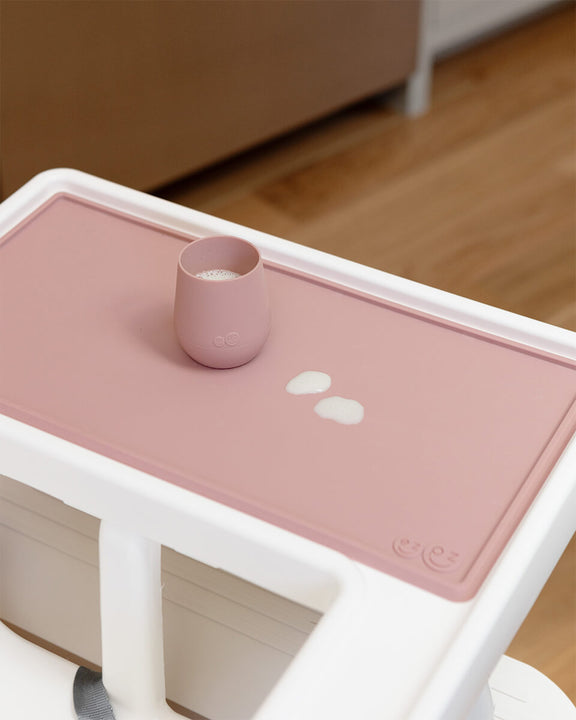 The Tiny Placemat in Blush is a non-slip, silicone placemat that fits on most highchair trays #color_blush / Tiny Placemat – On-the-Go Mealtime Mat for Babies & Toddlers
