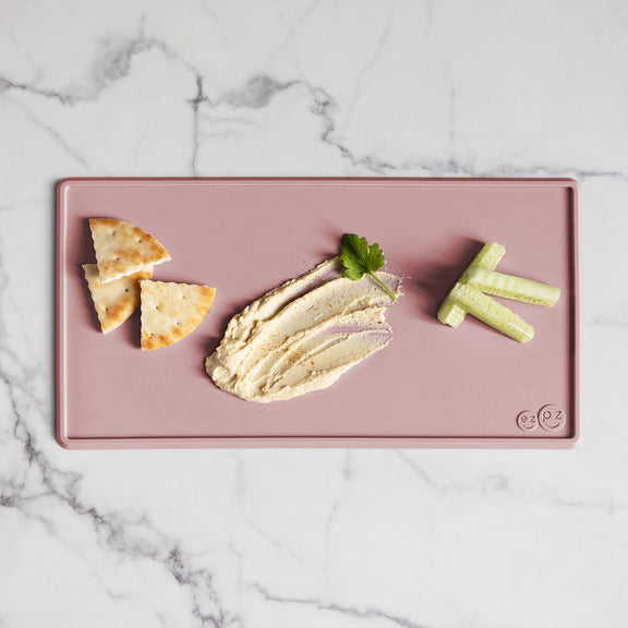 The Tiny Placemat in Blush is a non-slip, silicone placemat that fits on most highchair trays #color_blush / Tiny Placemat – On-the-Go Mealtime Mat for Babies & Toddlers