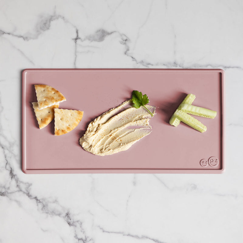 The Tiny Placemat in Blush is a non-slip, silicone placemat that fits on most highchair trays #color_blush / Tiny Placemat – On-the-Go Mealtime Mat for Babies & Toddlers