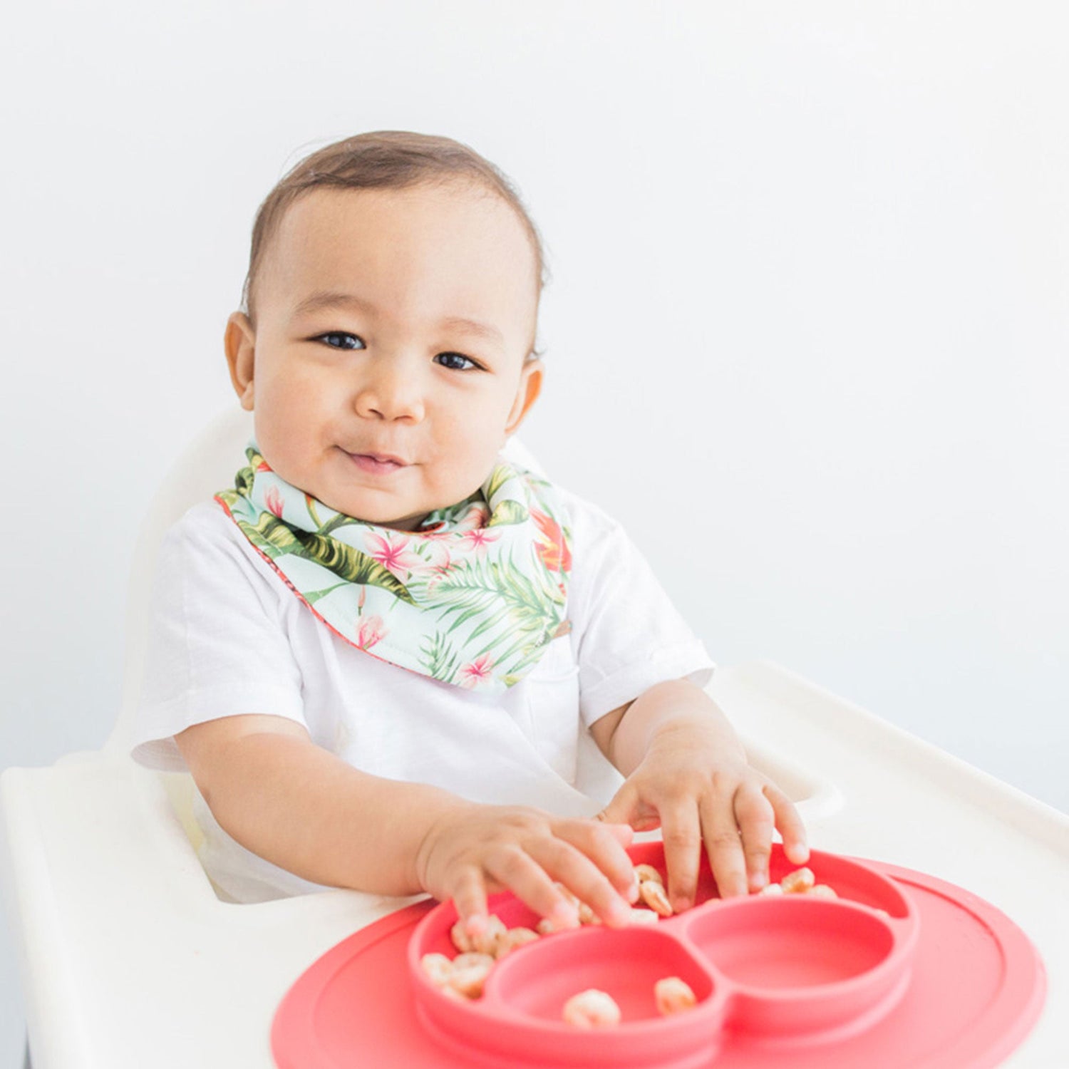 The Mini Mat in Coral by ezpz / Self-Suctioning Silicone Plate + Placemat #color_coral