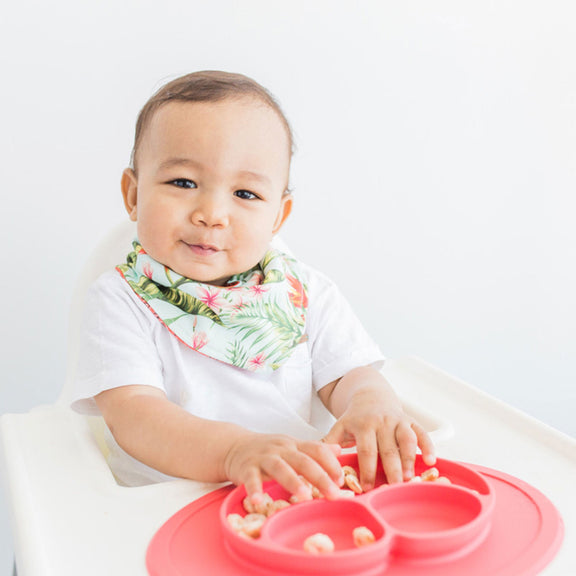 The Mini Mat in Coral by ezpz / Self-Suctioning Silicone Plate + Placemat #color_coral