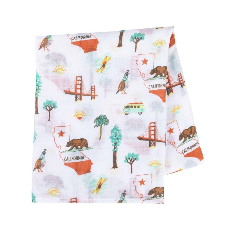 Gift set with a California Baby muslin swaddle blanket and burp cloth/bib combo, featuring a playful bear design.